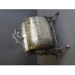 A Victorian Silver Plate Decorative Double Sided Food Warmer, on four supports with handle in