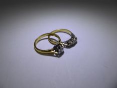 An 18ct Yellow Gold Three Stone Diamond Ring, size M together with another 18 ct yellow gold