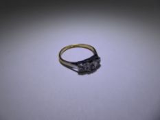 An Antique 18 ct Yellow Gold and Platinum Three Stone Diamond Ring, 12 to 14 pts old cut dias,