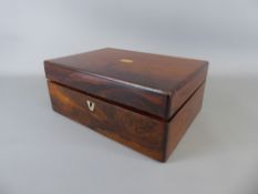 An Antique Rosewood Sewing Box, the box having fitted interior and mother of pearl badge to top,