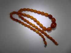 A Set of Antique Butterscotch Graduated Amber Beads, approx 11 - 20 mm, 70 cms in length,approx 40