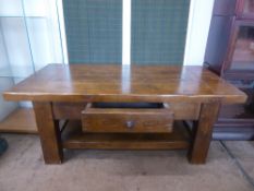 A Solid Oak Coffee Table with central drawer to front, approx 120 x 50 x 60 cms