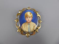 An Antique Yellow Metal Mourning Pendant Portrait, depicting a young boy, approx 31.3 gms.
