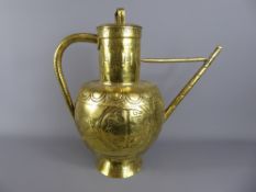 A 19th Century Dutch Brass Ewer, the lidded ewer depicting a repoussé Victorian coat of arms to