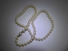 A Set Of Kiara Cultured Pearls, with original certificate and box, clasp stamped 750, approx 45 cms,