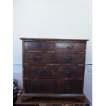 An Antique Chest of Drawers, two short drawers and three graduated drawers beneath, brass swan