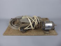 An Antique Watchmaker's Lathe marked 'Universal Motor, British Made', complete with full top