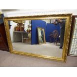 An Ornate Gilt Wood Style Wall Mirror, approx 90 x 137 cms.