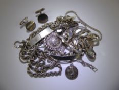 A Collection of Silver Jewellery, including curb link identity bracelet, necklaces, cuff links