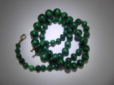 A Graduated Malachite and Green Glass Beaded Necklace, approx 70 cms.