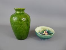 William Moorcroft Bowl, depicting tulips together with a green glaze vase, approx 17 cms. (2)