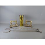 Two Brass and Metal Fireside "Dogs" with two fire implements together with a "trench art" brass