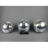 Three Retro Mirror-Glass Disco Glitter Balls, one 19 cms dia. and the other two 21 cms dia., one