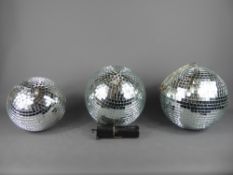 Three Retro Mirror-Glass Disco Glitter Balls, one 19 cms dia. and the other two 21 cms dia., one