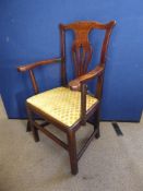 A Chippendale Style Oak Arm Chair with lyre back, fabric seat, straight legs and stretchers.