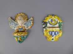 A Pair of Antique Italian Maiolica Wall Pockets, depicting Angels, approx 14 and 12 cms,