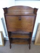 An Early 20th Century Oak Fall Front Book Case, the interior fitted with pigeon holes above two book