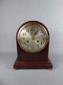 An Edwardian Oak Cased Mantel Clock, with a German Junhan B13 movement, approx 30 x 25 cms.