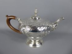 A Georgian Silver Tea Pot with wooden handle (broken), London hallmark, dated 1814, mm Edward,