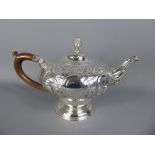 A Georgian Silver Tea Pot with wooden handle (broken), London hallmark, dated 1814, mm Edward,