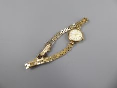 A Lady's 9 ct Gold Favre Leuba Cocktail Watch, having a white face with baton numerals, on 9 ct gold