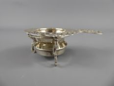 A Silver Vinaigrette with semi-precious stone lid together with a silver plated tea strainer.