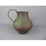 An Antique Egyptian Hammered Copper Water Jug, Islamic signature to neck, approx 20 cms, the jug