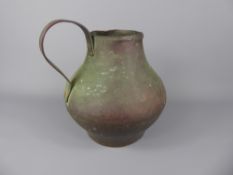 An Antique Egyptian Hammered Copper Water Jug, Islamic signature to neck, approx 20 cms, the jug