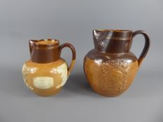 Two Antique Royal Doulton Commemorative Harvest Jugs, one with raised decoration and inscription '