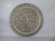 An Antique Middle Eastern Copper Charger, approx 67 cms diameter.