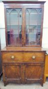 An Antique Mahogany Bureau Book Case, double cupboards beneath a fall-front pull out appointed desk,