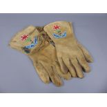 A Pair of Beige Skin Native American Gloves, with decorative beading in blue, green and red beads to