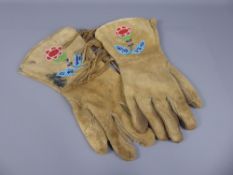 A Pair of Beige Skin Native American Gloves, with decorative beading in blue, green and red beads to