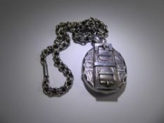 A Victorian Silver Locket and Chain, the locket having a buckle design, approx 4.5 x 4 cms, approx