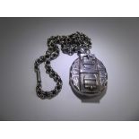 A Victorian Silver Locket and Chain, the locket having a buckle design, approx 4.5 x 4 cms, approx