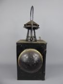 A Vintage Railway Signal Lamp with red and clear lenses.