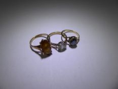 Three 9 Ct Yellow Gold Rings, including a 9 ct Black stone ring, size K, 9 ct Yellow Stone Ring,