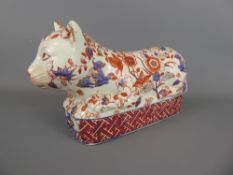 A Porcelain Oriental Opium Den Rest in the form of a cat, hand painted foliate design, character