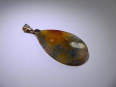 A Moss Agate Pendant, with 9 ct gold suspension ring, approx 46 x 26 cms, approx 12.2 gms.