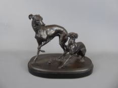 A Bronze Sculpture of Two Grey Hounds at play on an ebony plinth, signed Mene, approx 21 cms.