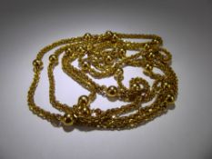 An Antique 18 ct / 22 ct Yellow Gold Muff Chain, the chain of spherical multi-link design, approx