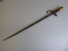 A 19th Century French Bayonet, brass and wood grip, triangular blade, approx 51 cms, no scabbard,