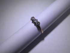 An Antique 18ct Yellow Gold and Platinum Three Stone Diamond Ring, size O, approx 1.3 gms.
