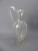 An Antique Ribbed Glass Claret Jug, with star engraving.