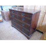 A Mahogany Chest of Drawers, two short and three graduated long drawers on bracket feet, swan neck