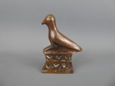 A Copper Opium Weight in the form of an Egyptian phoenix bird.