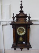 A Victorian Inlaid Wall Clock, with enamel face and Roman dial, the clock benefiting from decorative