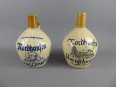 A Pair of Vintage Schnapps Nordhaufen Scotland Pottery Jugs, one with marks to base, approx 19 and