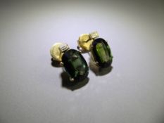 A Pair of 18ct Yellow Gold Green Sapphire and Diamond Earrings, oval sapphires approx 12 x 8 x 4 mm,