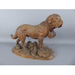 A Black Forest Carving, St Bernard Dog, approx 42 x 32 cms, depicted standing with a barrel at his